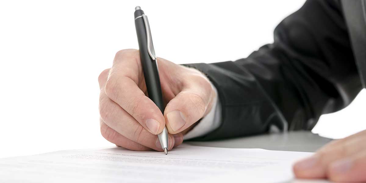 Man signing letter